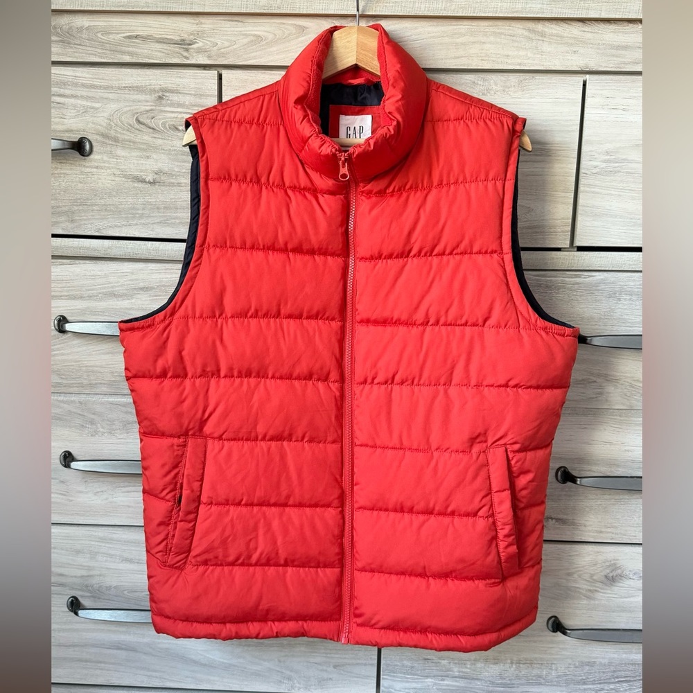 Very warm and light weight Gap Down Puffer Vest. Wild salmon color Size M.